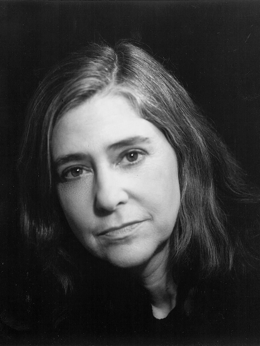 Black-and-white portrait of Margaret Hamilton against a dark background, her head slightly tilted.